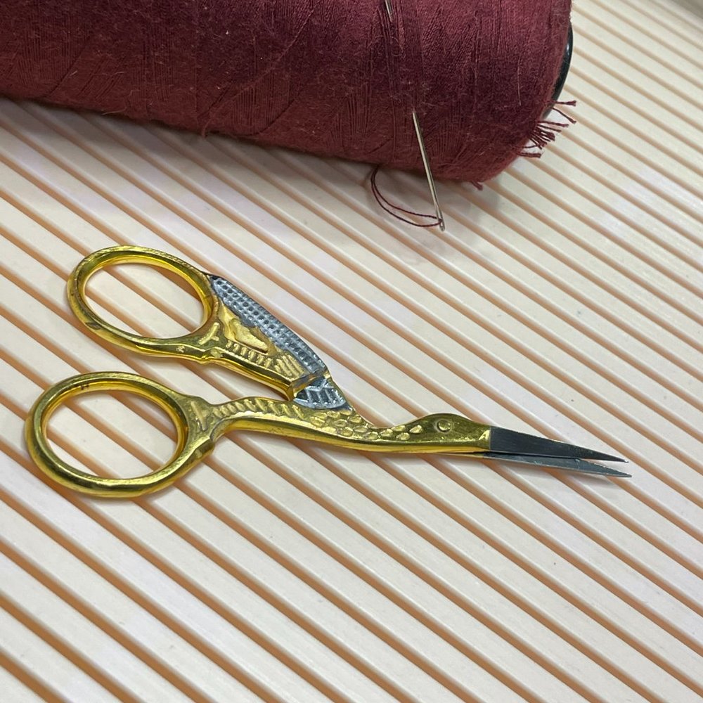 Vintage gold and silver tone crane/stork embroidery scissors 3 1/2"